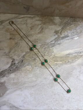 Elegant Gold Necklace with Green Gemstone Accents